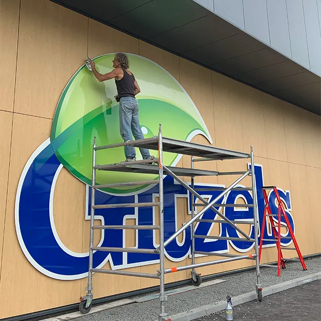 Montage van de grote Gitzels-geveltekst
